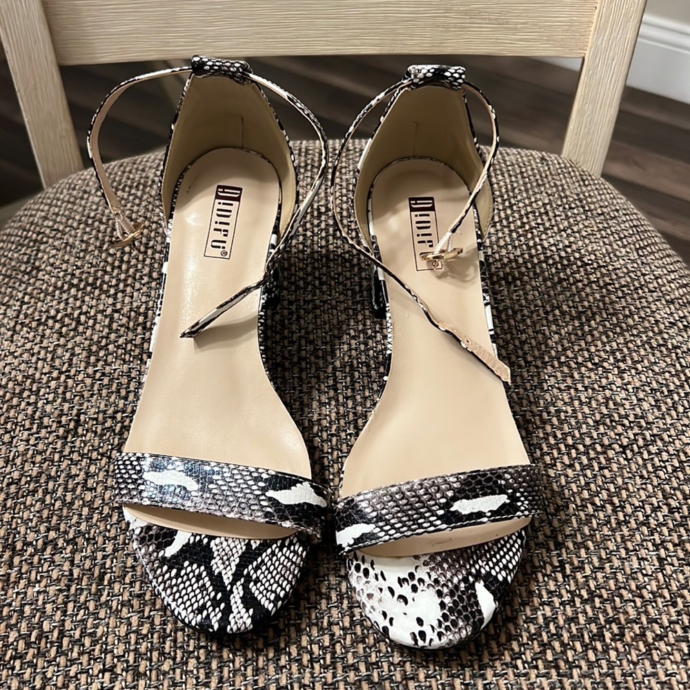 Size 6.5, 1.5 inch snakeskin heels with adjustable straps.